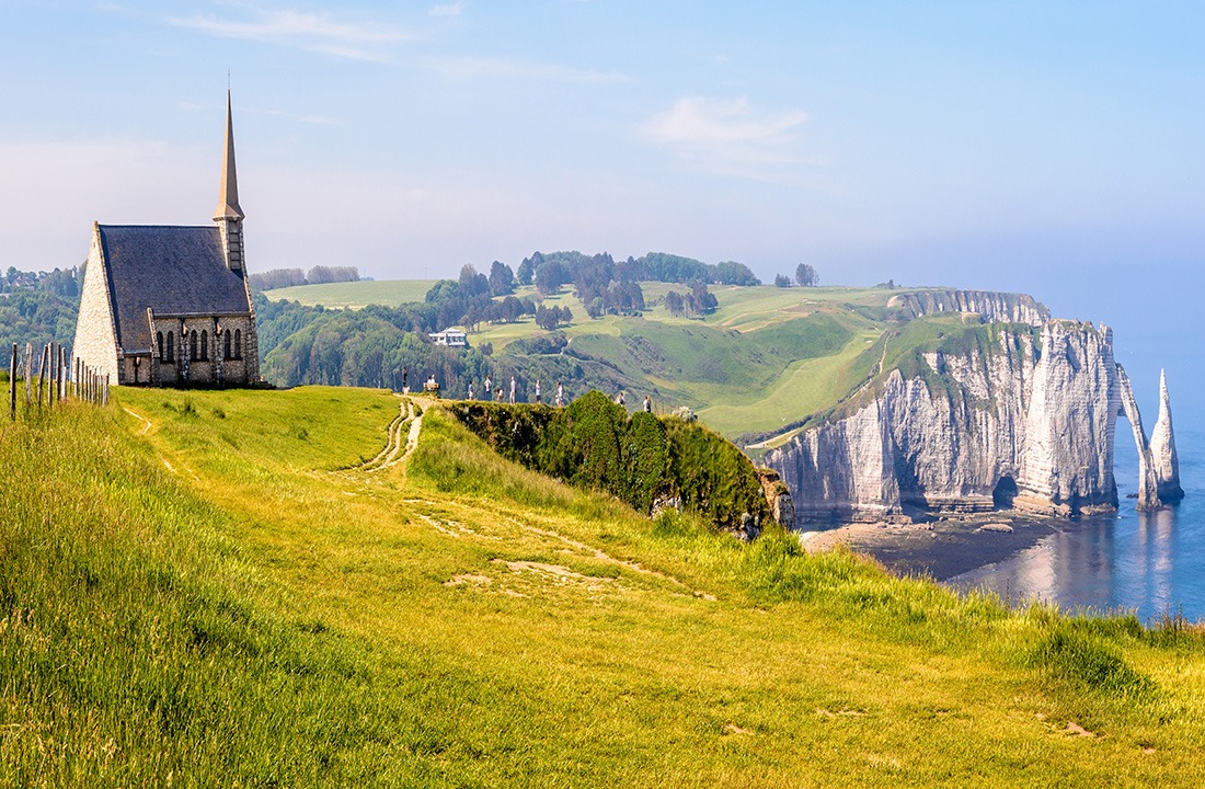 Notre-Dame de la Garde chapel, the arch and the Needle in Etretat, Normandy.