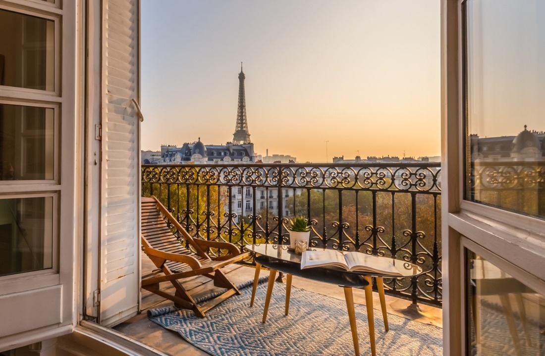 beautiful paris balcony at sunset with eiffel tower view